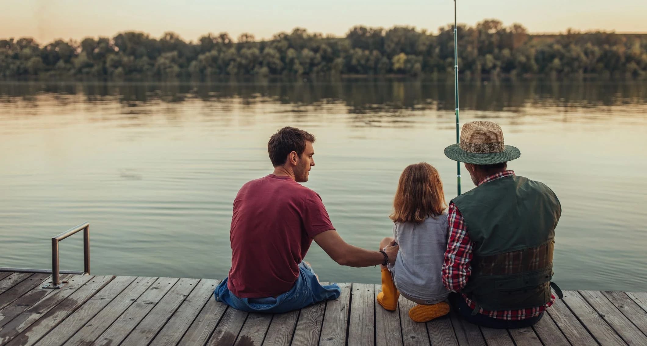 Grandfather, father and boy fishing